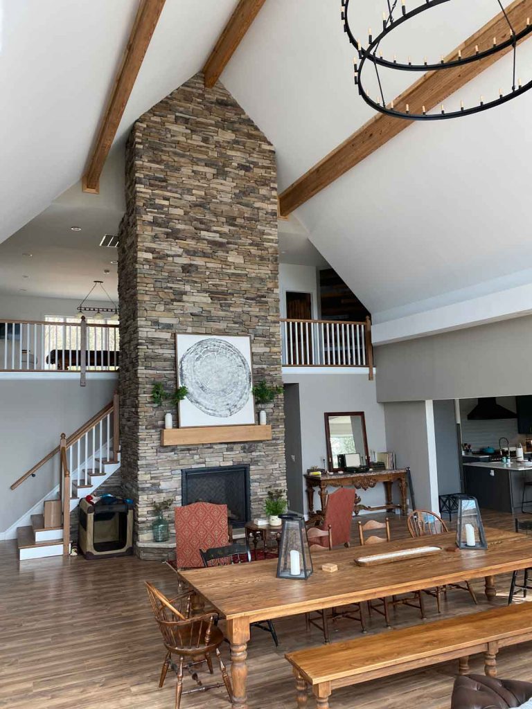 Living room with large stone fireplace