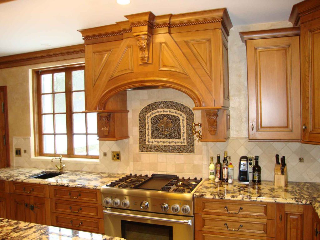 Gas stove with decorative stone backsplash installed by Home Pro Builders LLC