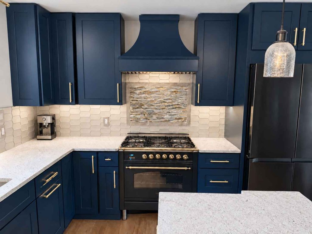 Newly remodeled kitchen with jewel-toned blue cabinets